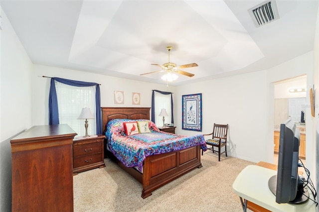 1602 NW 117th Ter, Gainesville, FL 32606 - bedroom featuring a raised ceiling, light colored carpet, and a ceiling fan