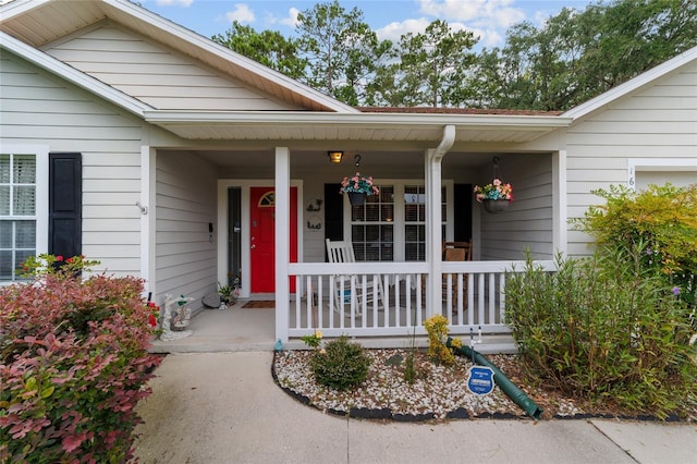 1602 NW 117th Ter, Gainesville, FL 32606 - doorway to property featuring covered porch