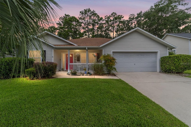 1602 NW 117th Ter, Gainesville, FL 32606 - ranch-style home featuring a porch, driveway, an attached garage, and a front lawn