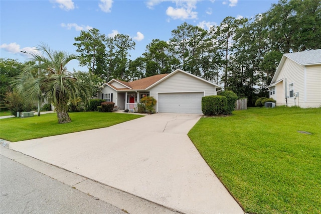 1602 NW 117th Ter, Gainesville, FL 32606 - view of front facade with an attached garage, a front yard, and concrete driveway
