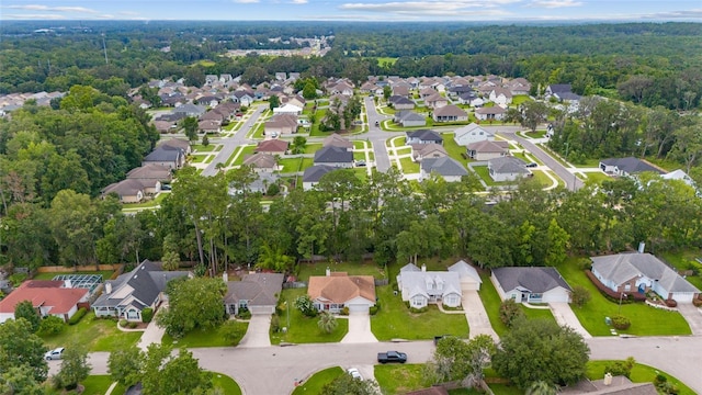 1602 NW 117th Ter, Gainesville, FL 32606 - aerial overview of property's location featuring nearby suburban area and a forest