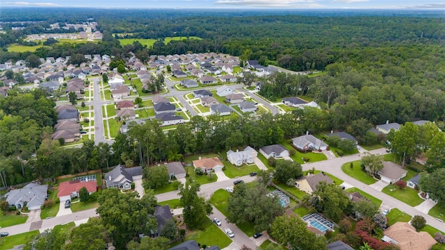 1602 NW 117th Ter, Gainesville, FL 32606 - aerial view of property and surrounding area with a heavily wooded area and nearby suburban area