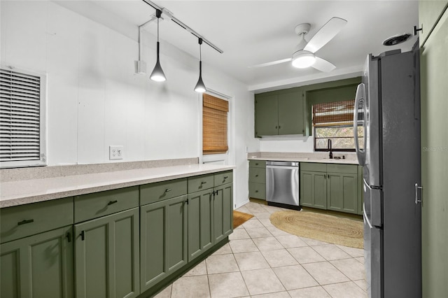 2225 NE 6th Ter, Gainesville, FL 32609 - kitchen featuring green cabinetry, appliances with stainless steel finishes, light countertops, ceiling fan, and light tile patterned flooring