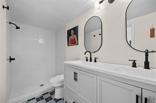 2225 NE 6th Ter, Gainesville, FL 32609 - full bathroom with double vanity and a tile shower