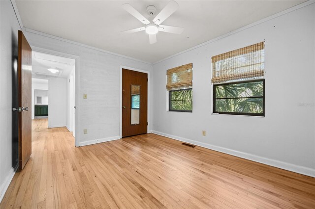 2225 NE 6th Ter, Gainesville, FL 32609 - spare room featuring ornamental molding, light wood-type flooring, and ceiling fan
