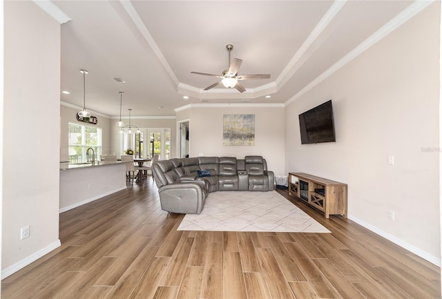 2782 SW 120th Dr, Gainesville, FL 32608 - living room with a raised ceiling, light wood-style floors, recessed lighting, ceiling fan, and crown molding