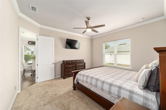 2782 SW 120th Dr, Gainesville, FL 32608 - bedroom with light carpet, crown molding, and a ceiling fan