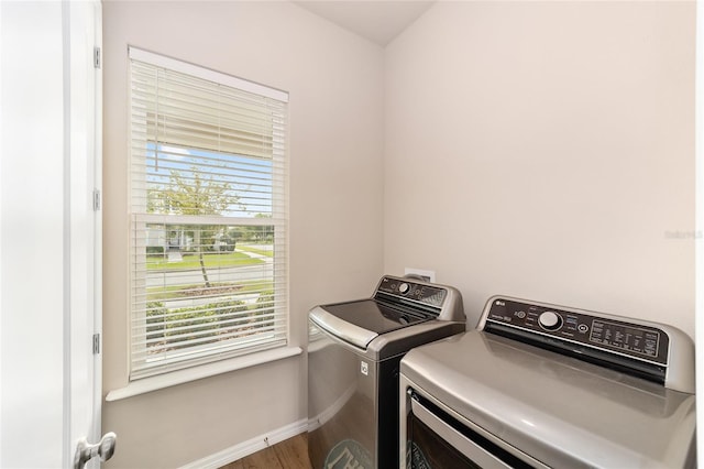2782 SW 120th Dr, Gainesville, FL 32608 - laundry room featuring washing machine and clothes dryer and wood finished floors