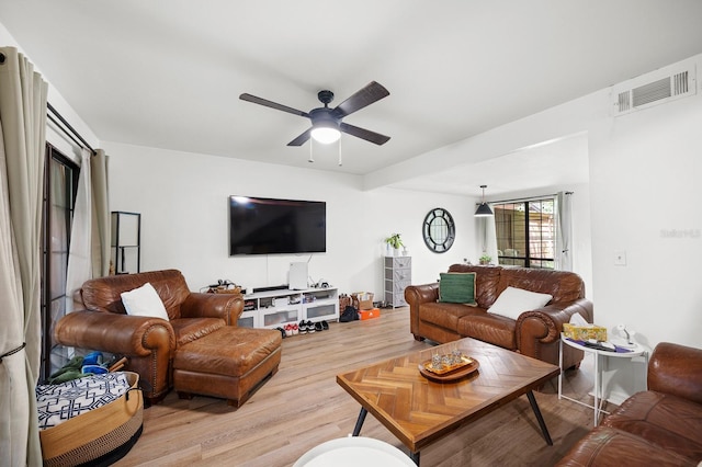 900 SW 62nd Blvd Unit I56, Gainesville, FL 32607 - living area featuring light wood finished floors and ceiling fan