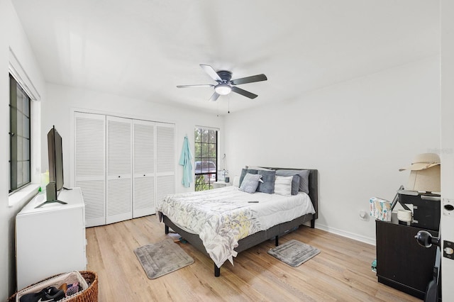 900 SW 62nd Blvd Unit I56, Gainesville, FL 32607 - bedroom with light wood-type flooring, a closet, and ceiling fan