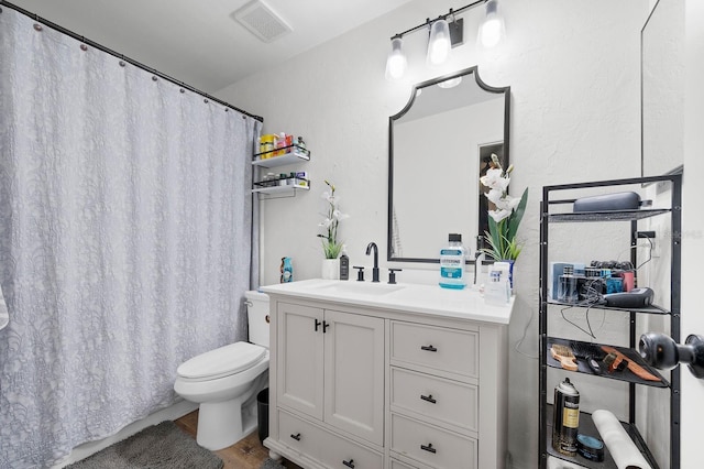 900 SW 62nd Blvd Unit I56, Gainesville, FL 32607 - full bathroom with vanity, wood finished floors, and curtained shower