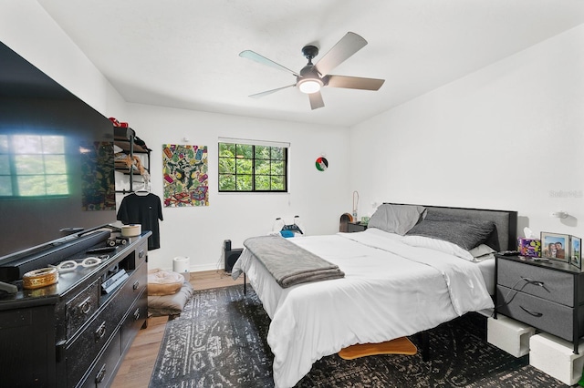 900 SW 62nd Blvd Unit I56, Gainesville, FL 32607 - bedroom with light wood finished floors and a ceiling fan