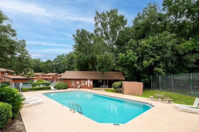 900 SW 62nd Blvd Unit I56, Gainesville, FL 32607 - community pool featuring a patio and view of wooded area