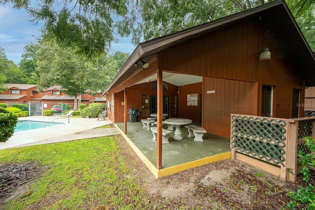 900 SW 62nd Blvd Unit I56, Gainesville, FL 32607 - back of house featuring a patio and an outdoor pool