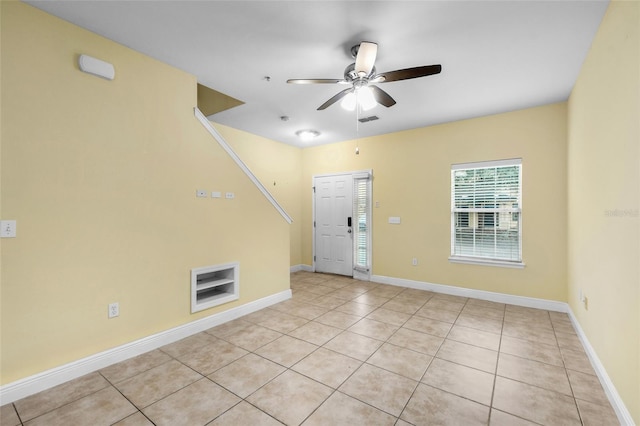 2960 SW 35th Pl Unit 66, Gainesville, FL 32608 - empty room with ceiling fan and light tile patterned flooring