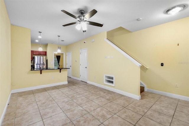 2960 SW 35th Pl Unit 66, Gainesville, FL 32608 - unfurnished living room with a ceiling fan, light tile patterned flooring, and stairs