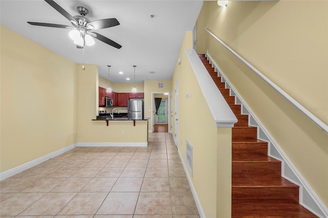 2960 SW 35th Pl Unit 66, Gainesville, FL 32608 - stairs featuring ceiling fan and tile patterned floors