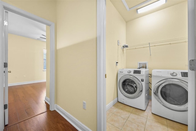 2960 SW 35th Pl Unit 66, Gainesville, FL 32608 - laundry area featuring separate washer and dryer and wood finished floors