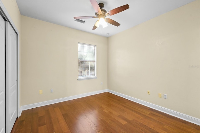 2960 SW 35th Pl Unit 66, Gainesville, FL 32608 - unfurnished bedroom with wood finished floors, a closet, and a ceiling fan