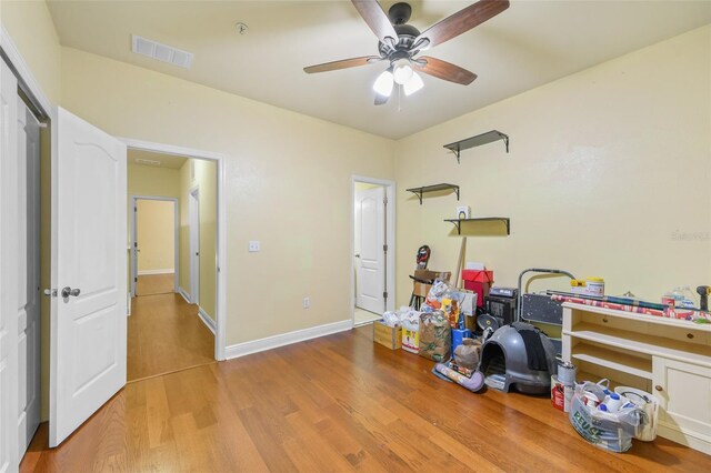 2960 SW 35th Pl Unit 66, Gainesville, FL 32608 - bedroom featuring wood finished floors and a ceiling fan
