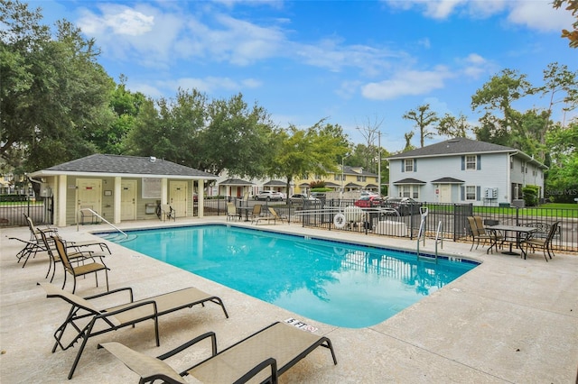 2960 SW 35th Pl Unit 66, Gainesville, FL 32608 - community pool featuring a patio area and a residential view
