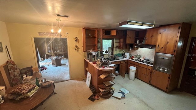 4985 NW 39th Ave, Gainesville, FL 32606 - kitchen featuring open shelves, brown cabinetry, wall oven, and light countertops