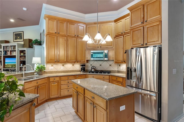 5025 NW 51st Pl, Gainesville, FL 32606 - kitchen featuring appliances with stainless steel finishes, a chandelier, light stone countertops, backsplash, and a kitchen island
