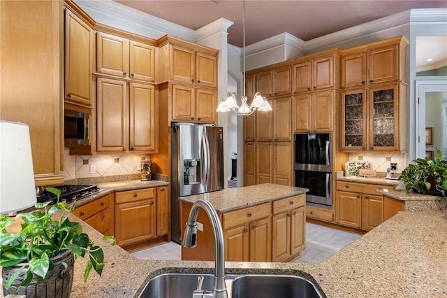 5025 NW 51st Pl, Gainesville, FL 32606 - kitchen featuring appliances with stainless steel finishes, tasteful backsplash, light stone countertops, crown molding, and decorative light fixtures
