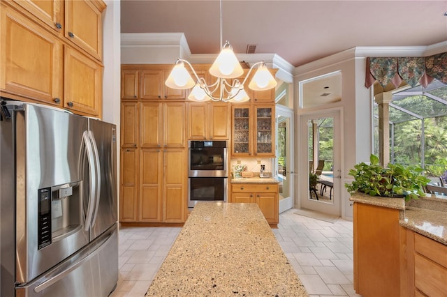 5025 NW 51st Pl, Gainesville, FL 32606 - kitchen with appliances with stainless steel finishes, stone tile floors, healthy amount of natural light, a chandelier, and ornamental molding