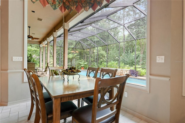 5025 NW 51st Pl, Gainesville, FL 32606 - dining room featuring baseboards and a sunroom