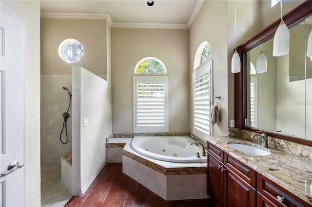 5025 NW 51st Pl, Gainesville, FL 32606 - bathroom with a whirlpool tub, walk in shower, vanity, crown molding, and wood finished floors