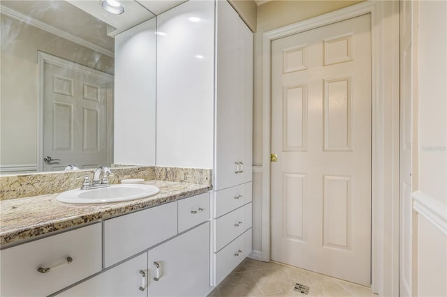 5025 NW 51st Pl, Gainesville, FL 32606 - bathroom featuring vanity, tile patterned flooring, and crown molding