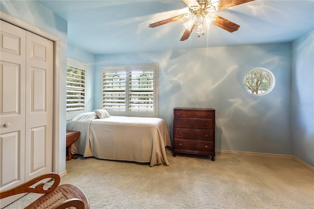5025 NW 51st Pl, Gainesville, FL 32606 - carpeted bedroom with a ceiling fan and a closet