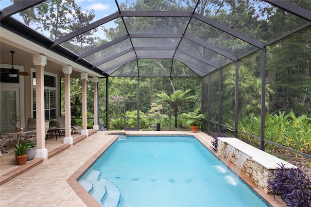 5025 NW 51st Pl, Gainesville, FL 32606 - outdoor pool with a ceiling fan, a patio area, and glass enclosure