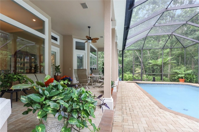 5025 NW 51st Pl, Gainesville, FL 32606 - outdoor pool featuring a patio area, ceiling fan, and glass enclosure