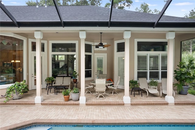 5025 NW 51st Pl, Gainesville, FL 32606 - back of property with a shingled roof, a patio area, and ceiling fan