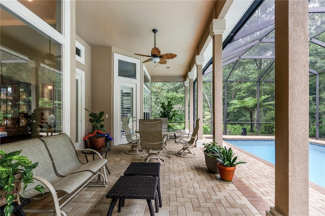 5025 NW 51st Pl, Gainesville, FL 32606 - view of patio with a ceiling fan, a lanai, an outdoor pool, and outdoor dining area