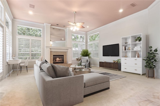 5025 NW 51st Pl, Gainesville, FL 32606 - living area with a ceiling fan, ornamental molding, light colored carpet, a glass covered fireplace, and recessed lighting