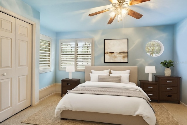 5025 NW 51st Pl, Gainesville, FL 32606 - bedroom with light colored carpet, a closet, and a ceiling fan