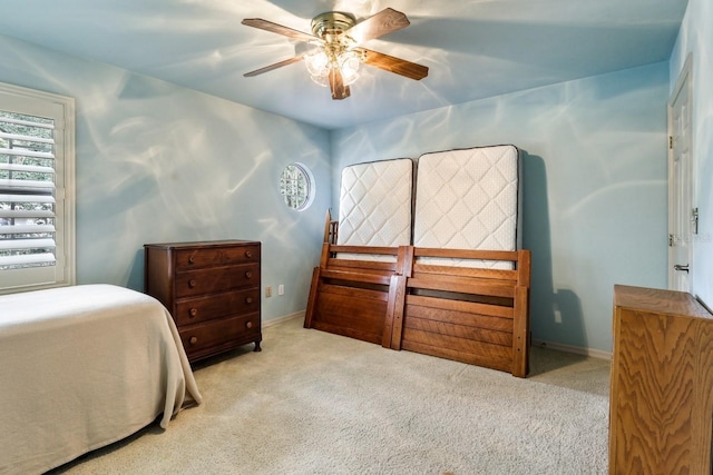 5025 NW 51st Pl, Gainesville, FL 32606 - carpeted bedroom featuring baseboards and ceiling fan