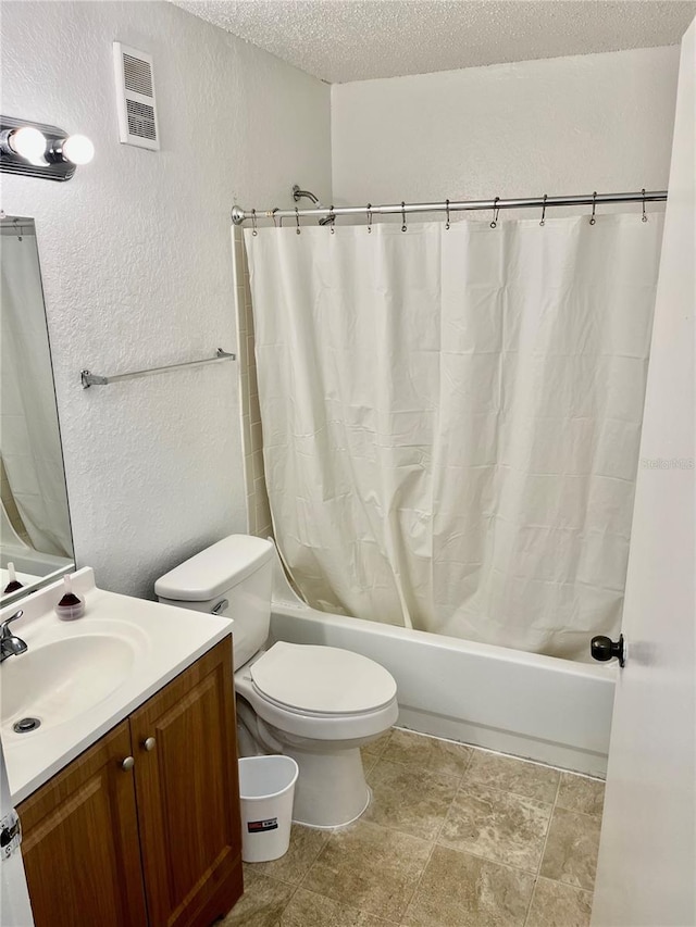 3705 SW 27th St Unit 1112, Gainesville, FL 32608 - bathroom with a textured wall, vanity, a textured ceiling, and shower / bath combo