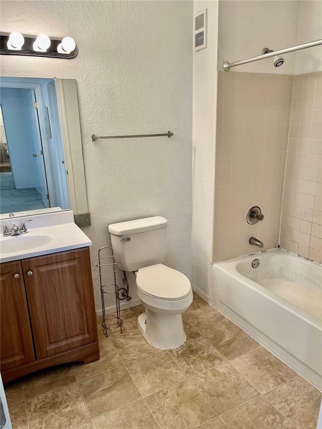 3705 SW 27th St Unit 1112, Gainesville, FL 32608 - bathroom with vanity,  shower combination, and a textured wall
