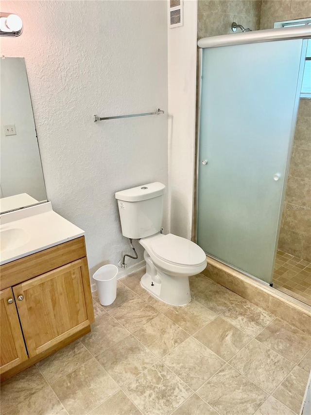 3705 SW 27th St Unit 1112, Gainesville, FL 32608 - full bath with vanity, a shower stall, and a textured wall