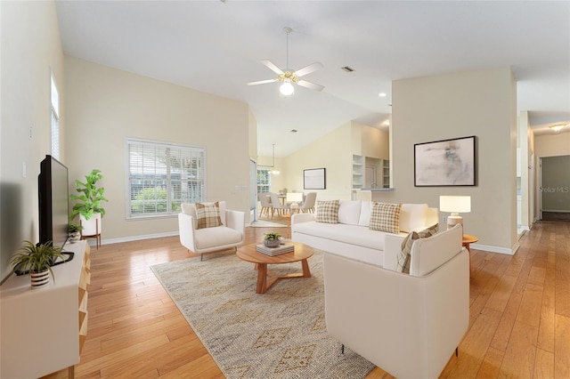8036 SW 72nd Pl, Gainesville, FL 32608 - living area with light wood finished floors, a ceiling fan, and lofted ceiling