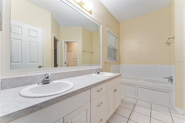 8036 SW 72nd Pl, Gainesville, FL 32608 - bathroom featuring tile patterned floors, double vanity, a garden tub, and a walk in closet