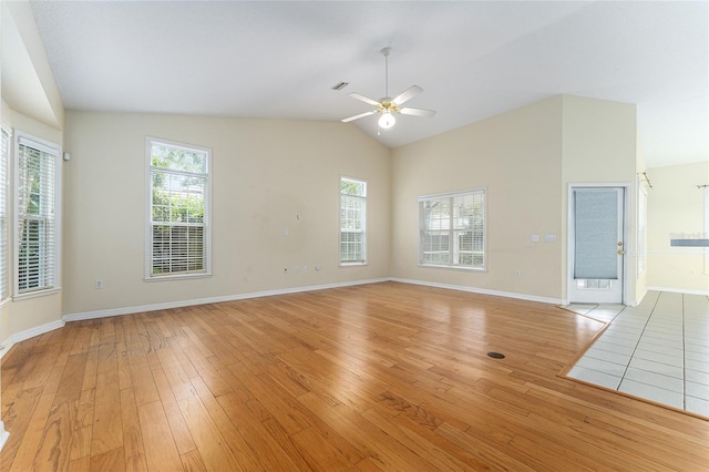 8036 SW 72nd Pl, Gainesville, FL 32608 - unfurnished living room with lofted ceiling, a ceiling fan, light wood finished floors, and healthy amount of natural light
