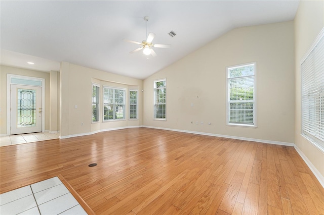 8036 SW 72nd Pl, Gainesville, FL 32608 - unfurnished living room with light wood-type flooring, ceiling fan, healthy amount of natural light, and lofted ceiling