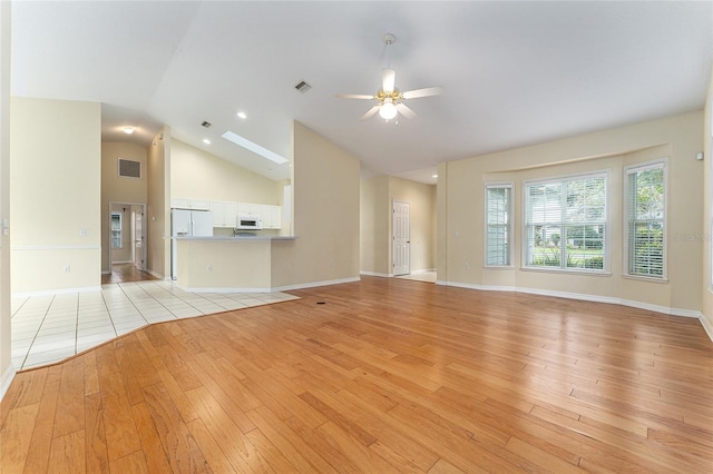 8036 SW 72nd Pl, Gainesville, FL 32608 - unfurnished living room with light wood-style flooring, a ceiling fan, and high vaulted ceiling