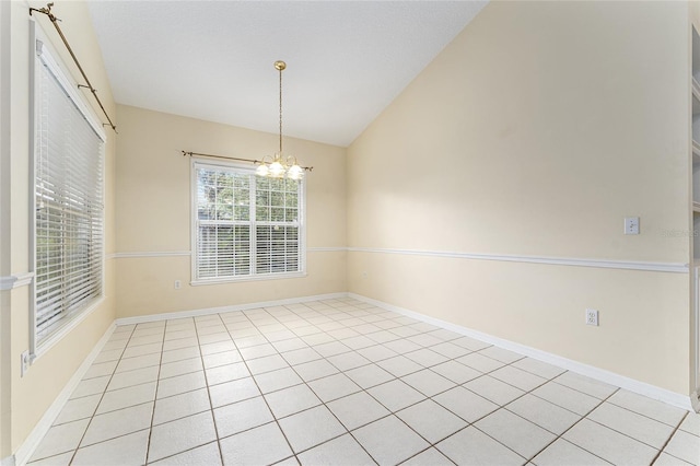 8036 SW 72nd Pl, Gainesville, FL 32608 - unfurnished room with vaulted ceiling, a chandelier, and light tile patterned floors