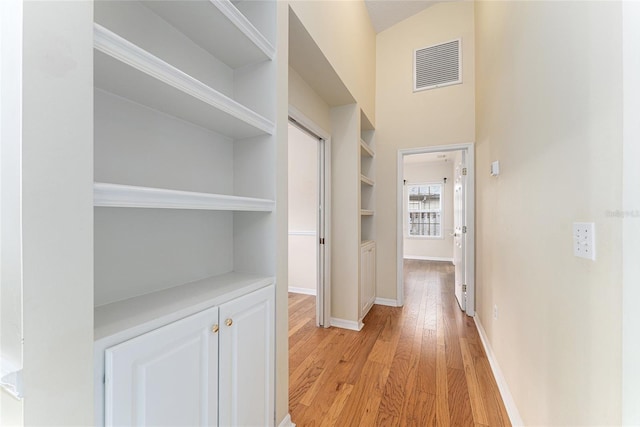8036 SW 72nd Pl, Gainesville, FL 32608 - hallway with light wood finished floors and baseboards